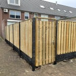 Levering en montage in Rotterdam - semi-luxe hout-beton schutting